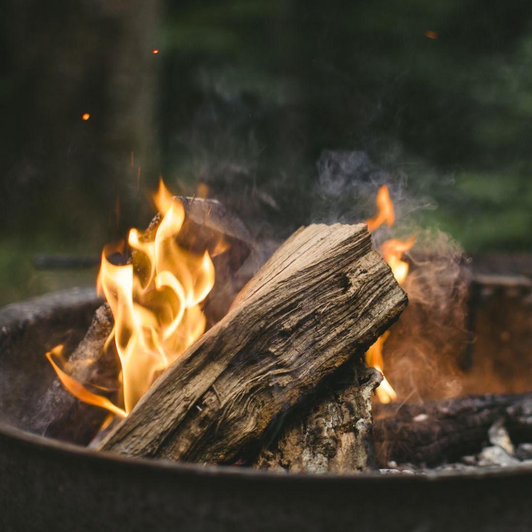 A fire pit going at dusk